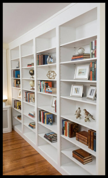 12ft wide by 8ft tall white Maple built-in library with floor-to-ceiling shelving designed for professional book collections.