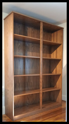 Twin Red Oak freestanding bookcase and vinyl record cabinet with a solid tabletop and finished side panel, designed as a portable built-in solution.