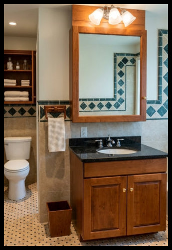 Custom Cherry wood bathroom suite featuring a raised panel vanity with a matching handcrafted medicine cabinet and coordinated wood light bar.