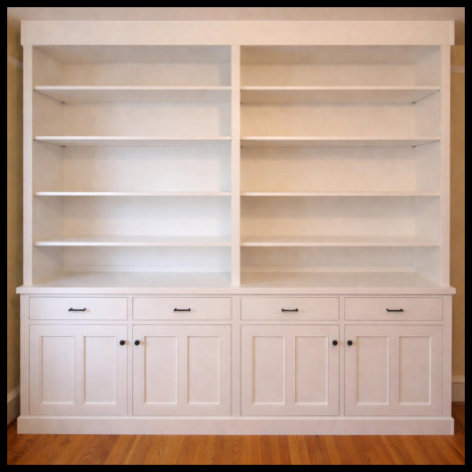 8x8 white custom cabinetry; 20-inch deep shelving for pottery and books with 4 double Mission doors and drawers.