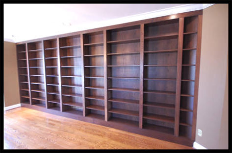 Massive 21ft wide by 9ft high custom Red Oak bookcases, 8-tier open-face library shelving with adjustable shelves.