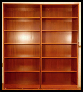 A pair of handcrafted Sapele wood freestanding bookcases, custom-built to client specifications with thick shelving and integrated anti-tip safety anchors.