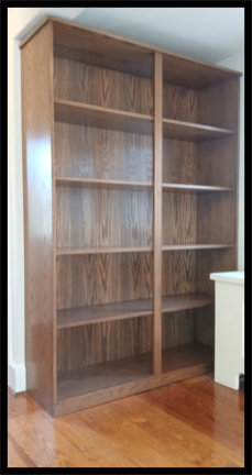 Custom red oak bookcase with deep shelving for vinyl records and books with tabletop.