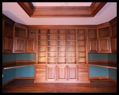 Solid Walnut Library Base Cabinetry with Raised Panel Doors, Drawer Banks, and Fluted Molding - No Particle Board.