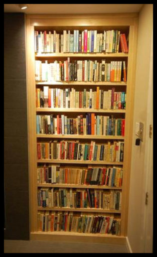 Design-Focused: Custom white maple built-in designed for a wall niche, featuring 1-inch thick adjustable shelving and a floor-to-ceiling 8-foot height.